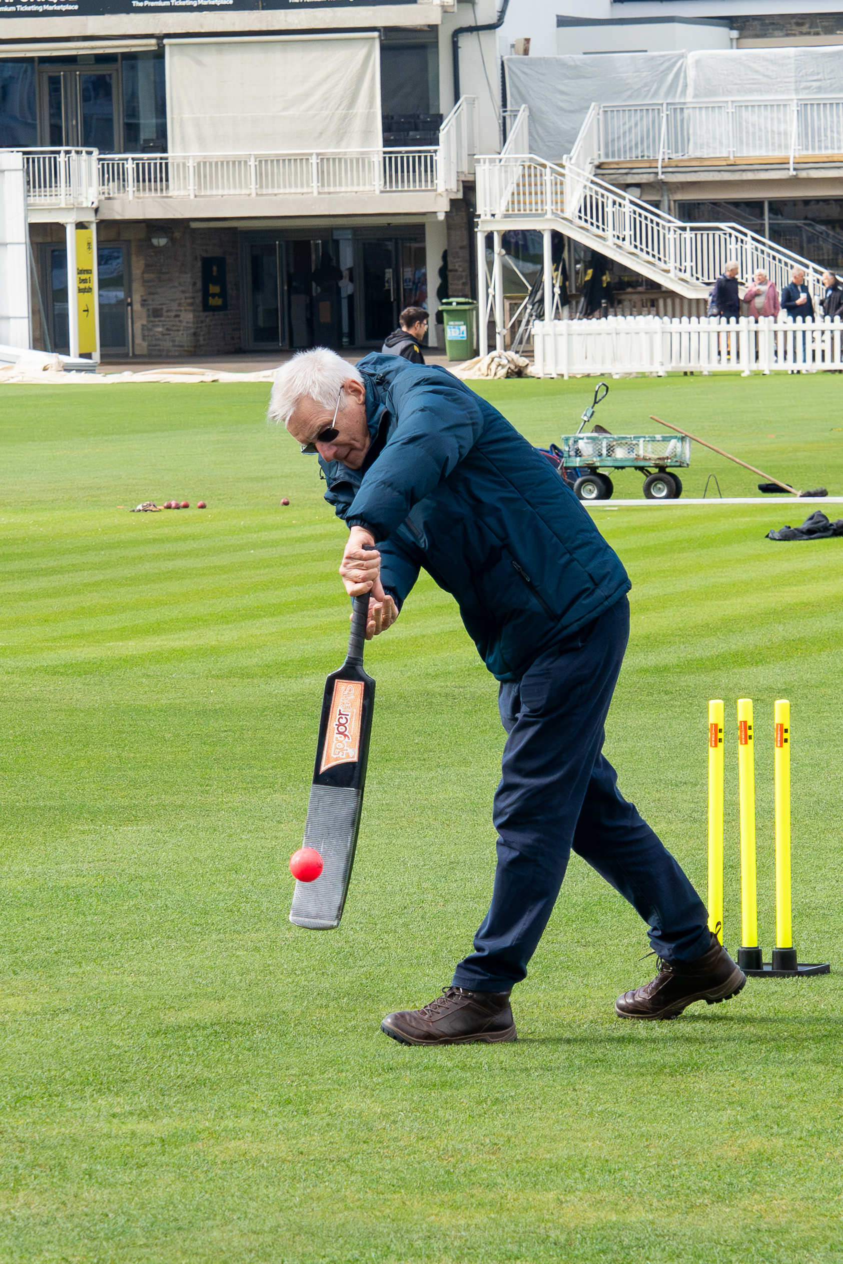 A man plays a drive during a walkers and talkers walking cricket session