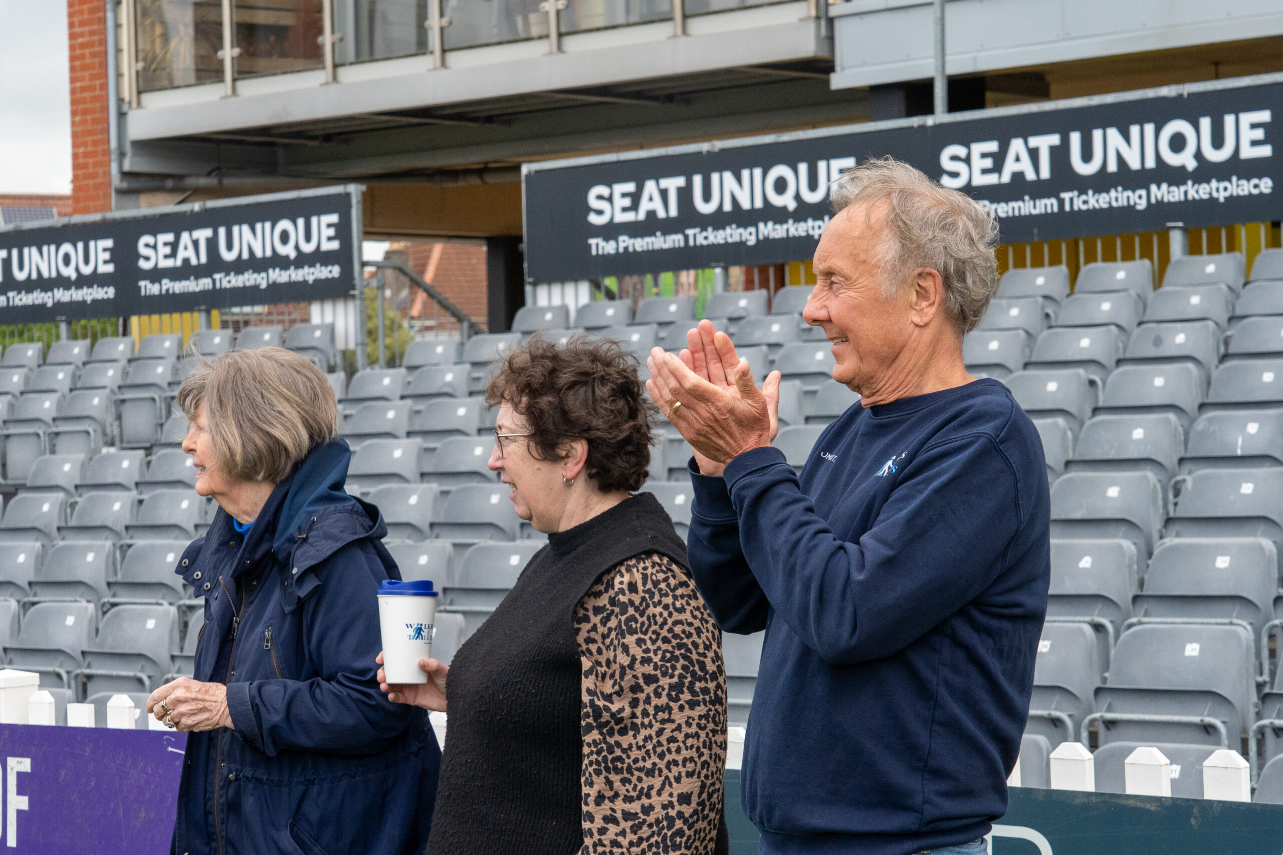 Andy Brassington and other walkers and talkers members clap during a walking cricket taster session