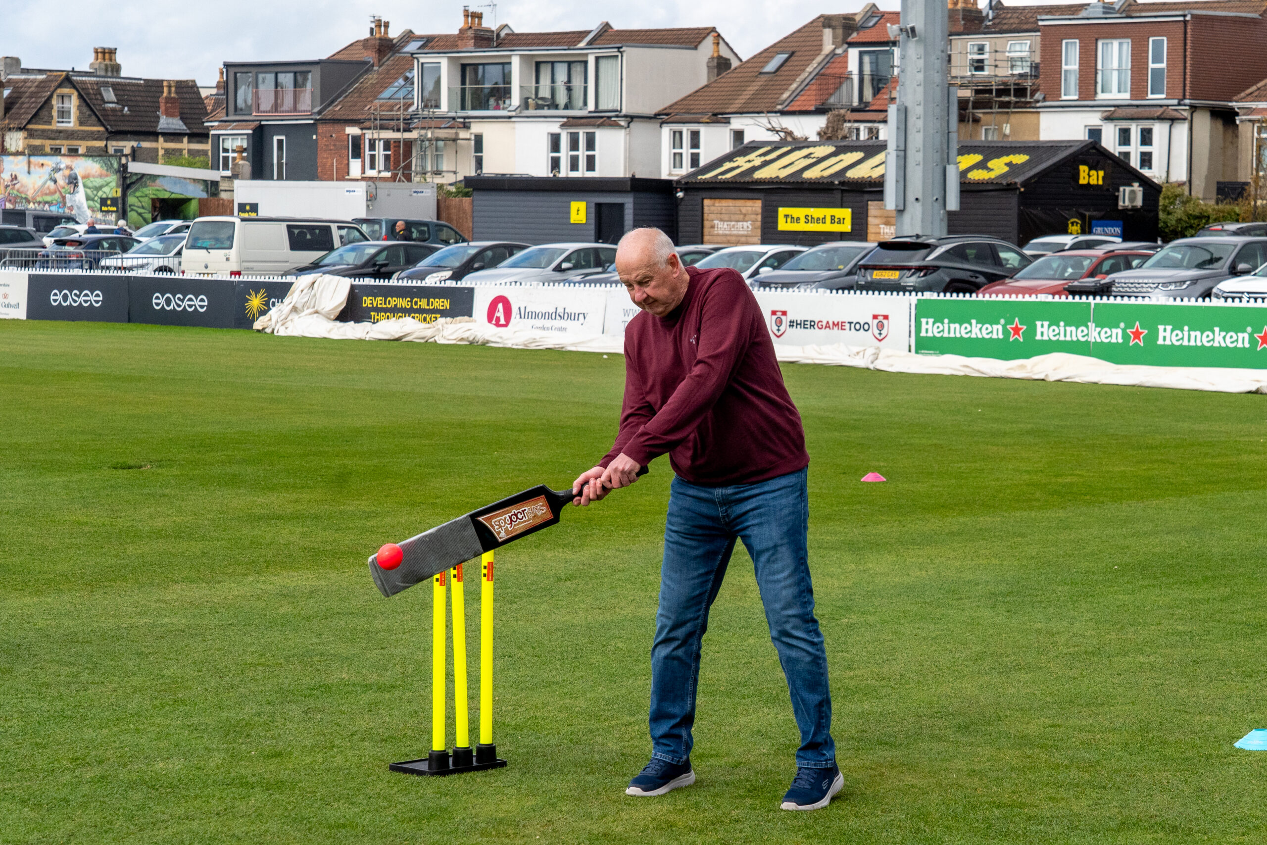 An older man plays a cuit shot during a walkers and talkers walking cricket taster session