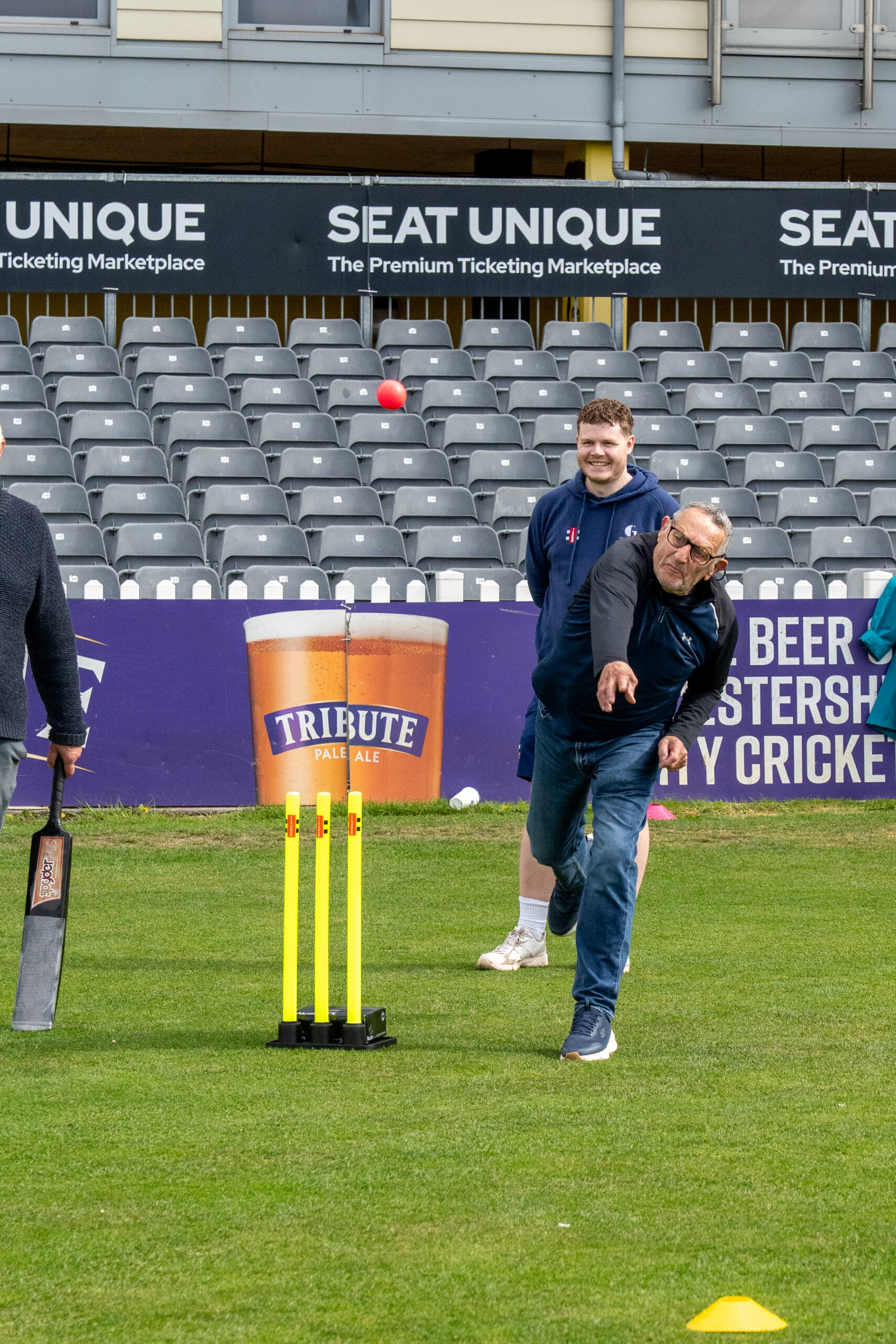A man bowls the ball during a walkers and talkers walking cricket session